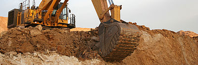 Excavator digs excavation